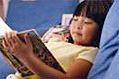 photo of a little girl reading